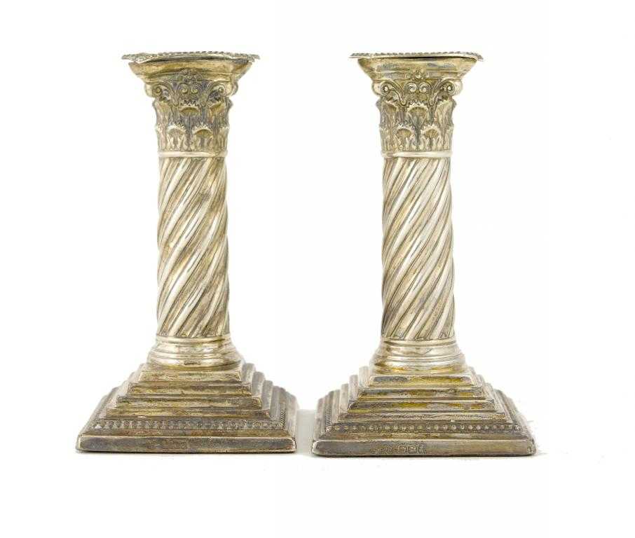 Appraisal: A PAIR OF VICTORIAN DWARF COLUMNAR CANDLESTICKS with beaded nozzle