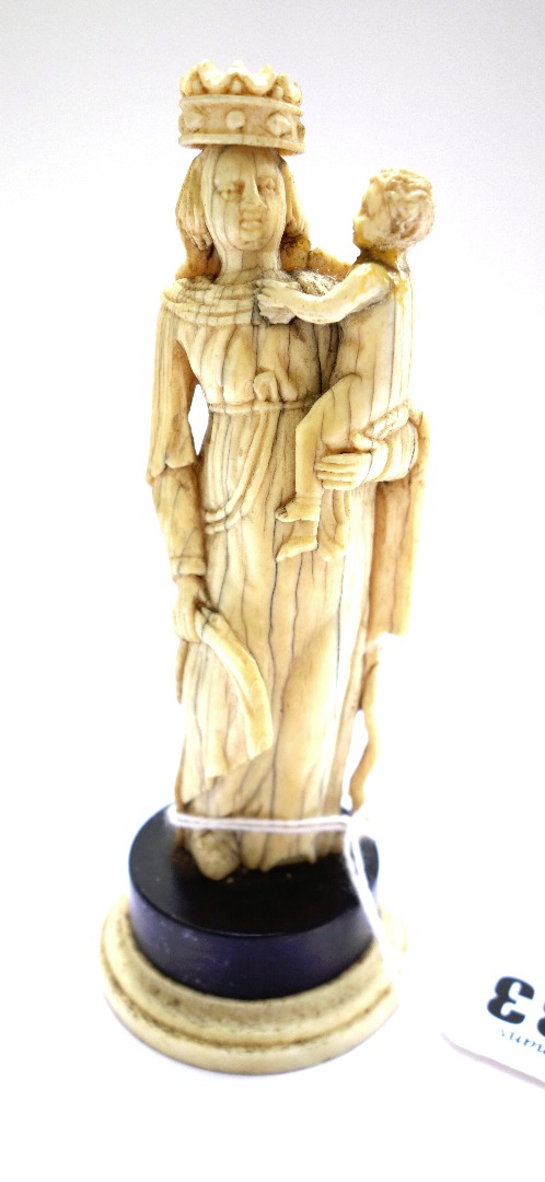 Appraisal: An ivory carving of the Madonna and child th century