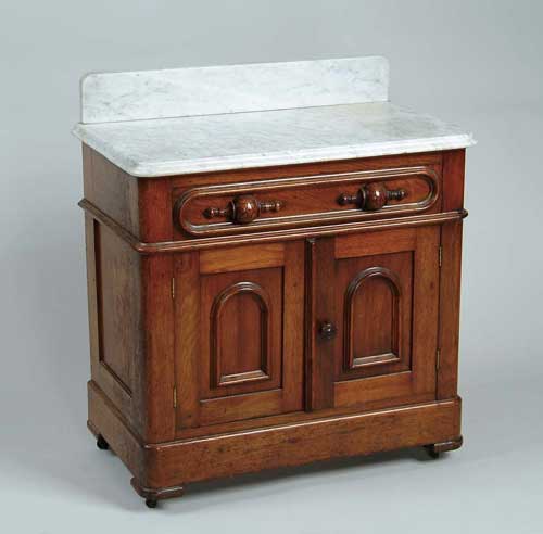 Appraisal: MARBLE TOP WALNUT COMMODE Matches above chest with race track