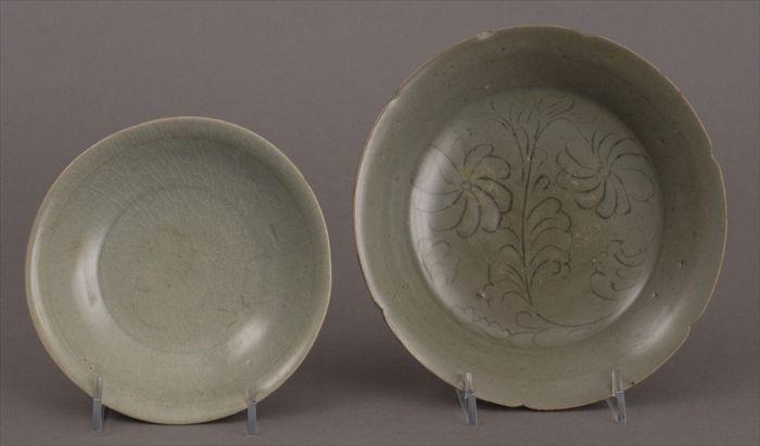 Appraisal: TWO CHINESE CELADON FOOTED DISHES The larger with -notched everted