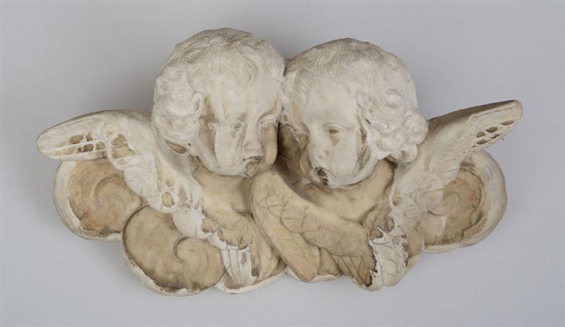 Appraisal: EUROPEAN BAROQUE CARVED MARBLE CHERUB WALL MOUNT Incorporating two cherub