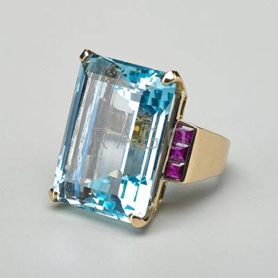 Appraisal: CTS AQUAMARINE AND RUBY RING Emerald cut aquamarine of good