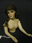 Appraisal: GERMAN BISQUE HALF DOLL All bisque painted features moveable arms