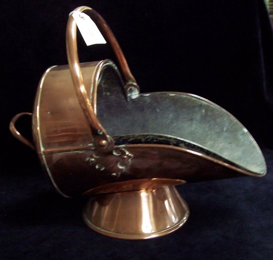 Appraisal: A copper coal scuttle with swing handle