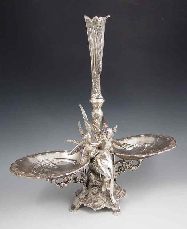 Appraisal: FIGURAL VICTORIAN STYLE SILVERPLATE EPERGNE Double bowl epergne with bud