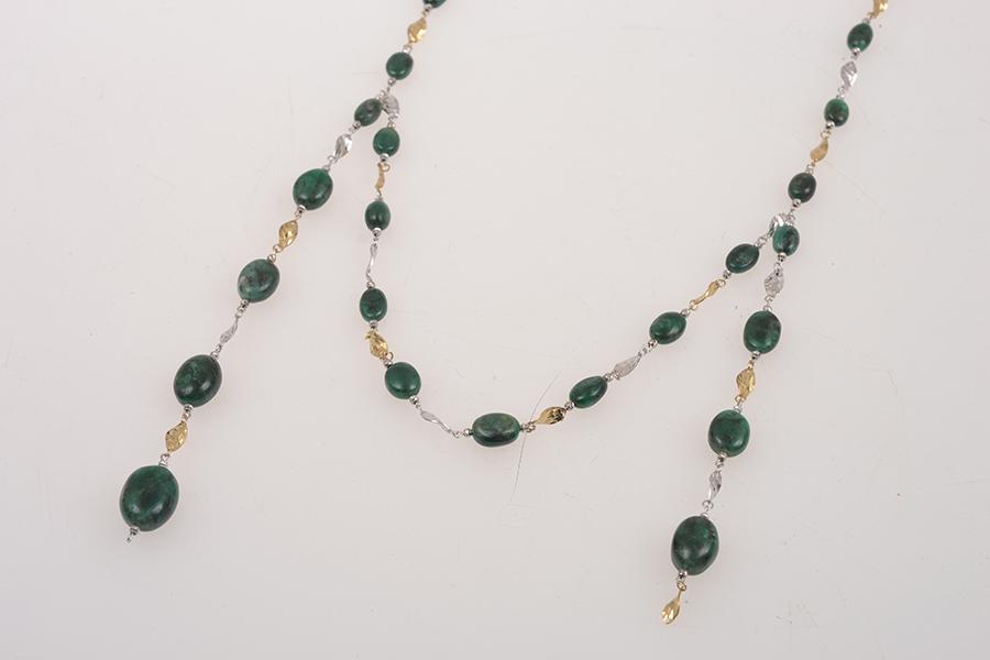 Appraisal: AN EMERALD BEAD NECKLACE IN CT WHITE AND YELLOW GOLD