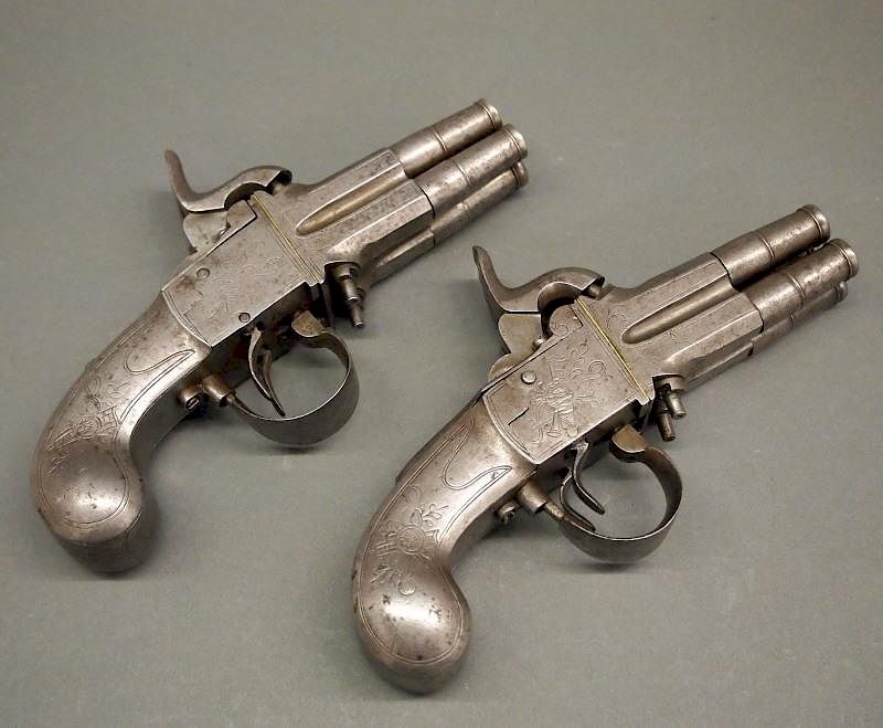 Appraisal: Pr th c four-barrel pistols A pair of mid th