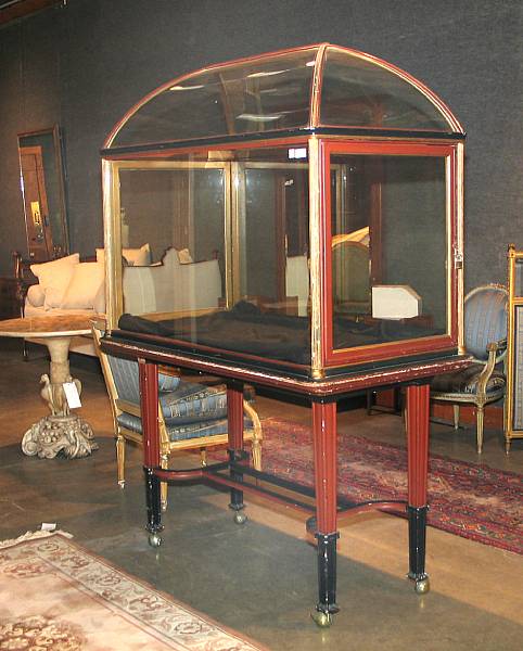 Appraisal: A Victorian parcel gilt ebonized glass display case height approximately