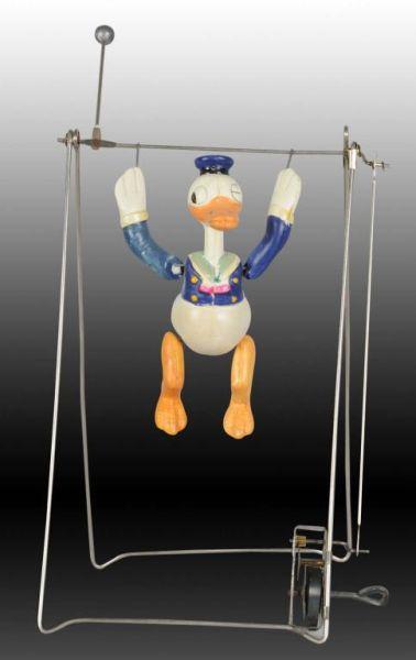 Appraisal: Walt Disney Celluloid Donald Duck Trapeze Toy Description Includes scarce