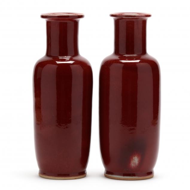 Appraisal: PAIR OF STONEWARE POTTERY VASES SIGNED th century oxblood glazed