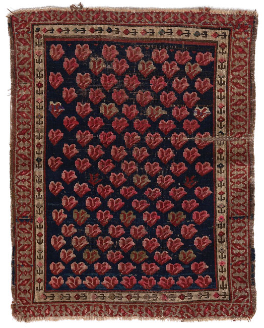 Appraisal: Caucasian mat c stylized floral design in red and pink