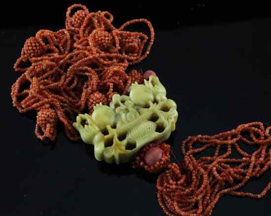 Appraisal: A 's Chinese coral bead and vegetable ivory necklace carved