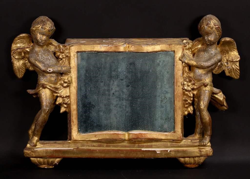 Appraisal: Figural Italian gilt and gesso mirror cherubs with book x