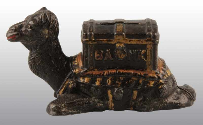 Appraisal: Cast Iron Kneeling Camel Still Bank Description Manufactured by Kyser