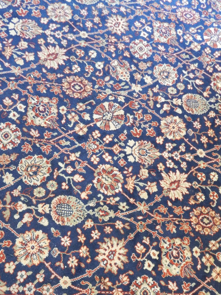 Appraisal: A machine woven Oriental style carpet with a design of