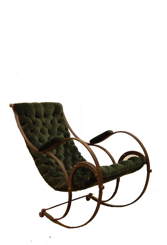 Appraisal: Continuous steel string frame rocker with hunter green tufed upholstery