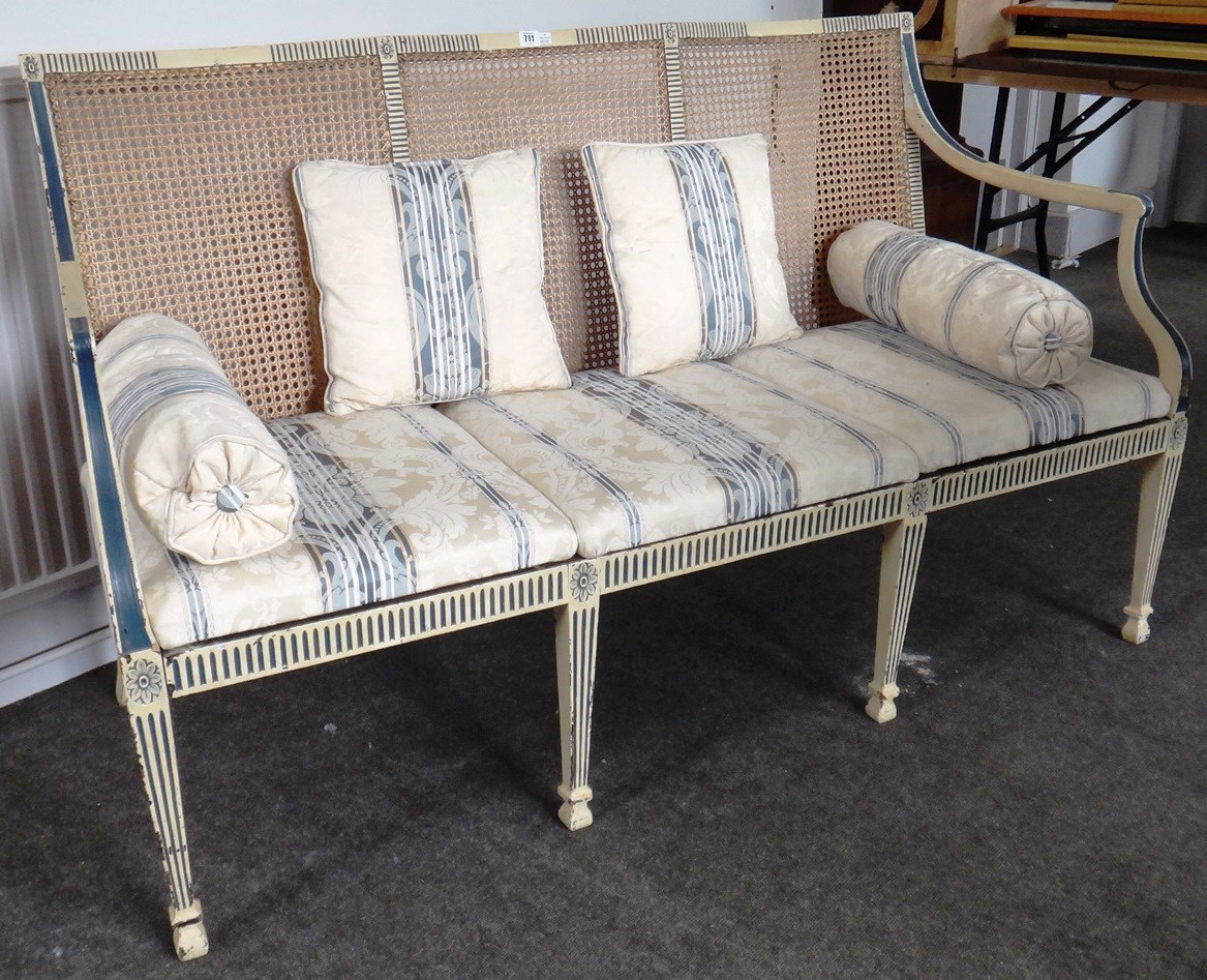 Appraisal: A Regency design cream and blue painted show frame sofa