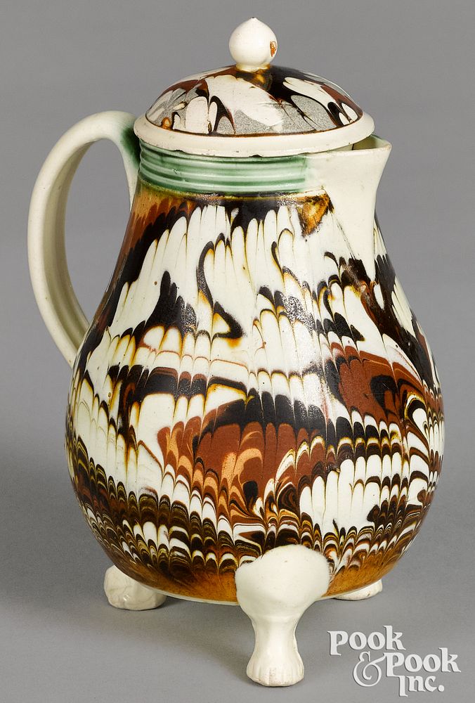 Appraisal: Mocha lidded pitcher with marbleized glaze Rare footed mocha lidded