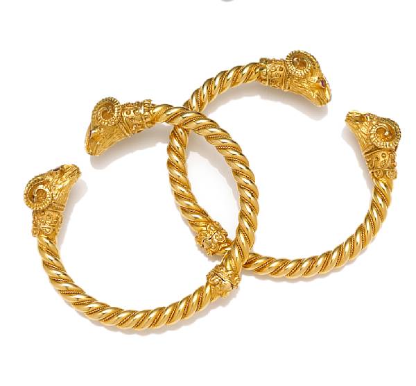 Appraisal: A pair of diamond ruby and fourteen karat gold bangle