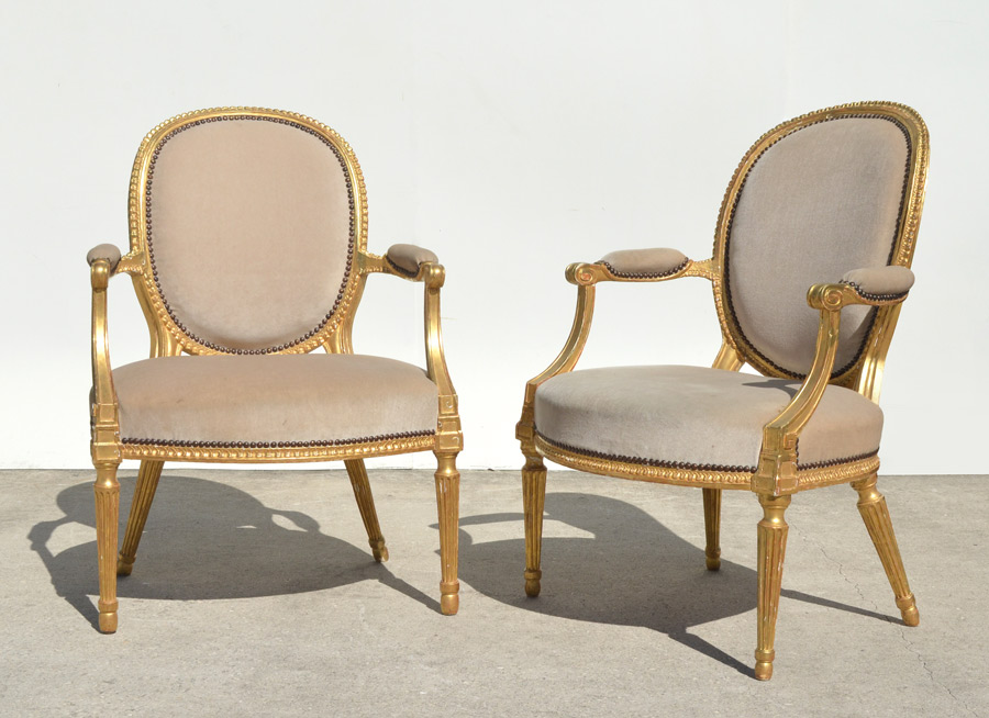 Appraisal: PAIR LOUIS XVI STYLE FAUTEUIL ARM CHAIRS Carved and gilt