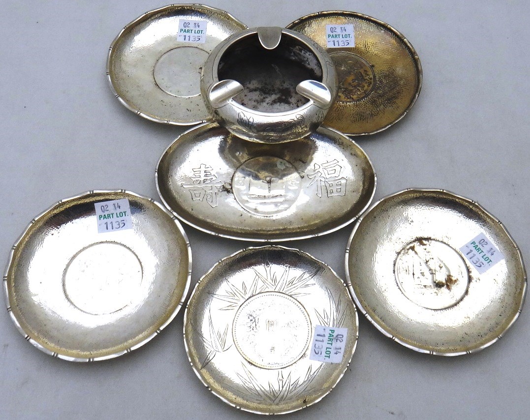 Appraisal: Six Oriental dishes each mounted with a coin at the