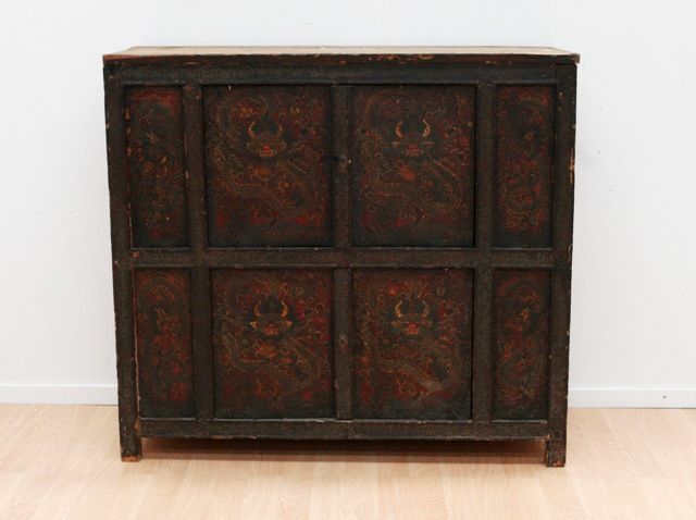 Appraisal: A Tibetan Monastery cabinet front of eight panels raised design