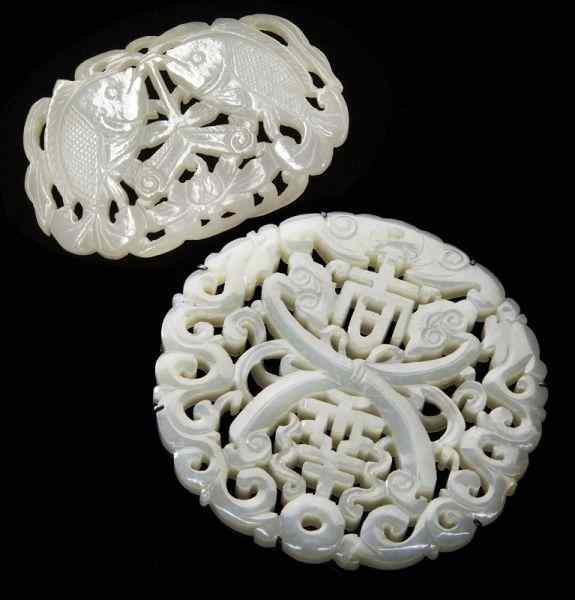 Appraisal: Chinese Qing carved jade pendantsdepicting double fish and lucky symbols