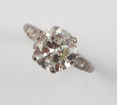 Appraisal: A diamond solitaire ring The round brilliant cut diamond weighs