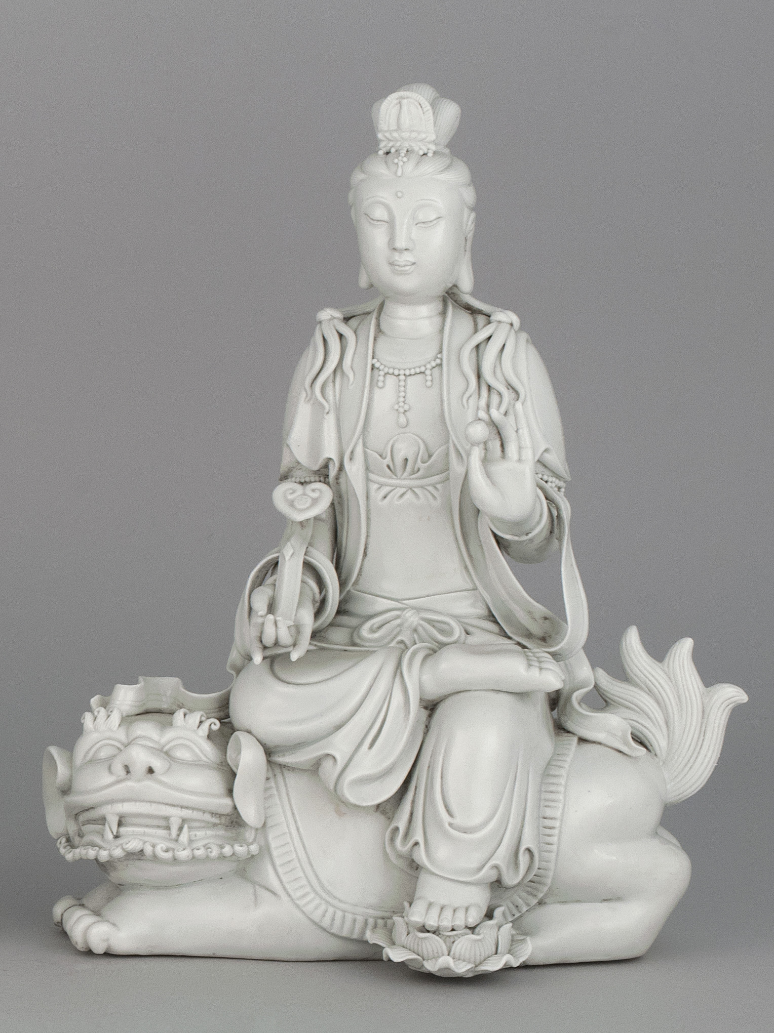 Appraisal: BLANC DE CHINE PORCELAIN FIGURE th CenturyDepicting Guanyin seated on