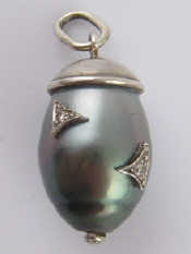 Appraisal: A grey South Sea cultured pearl and diamond pendant designed