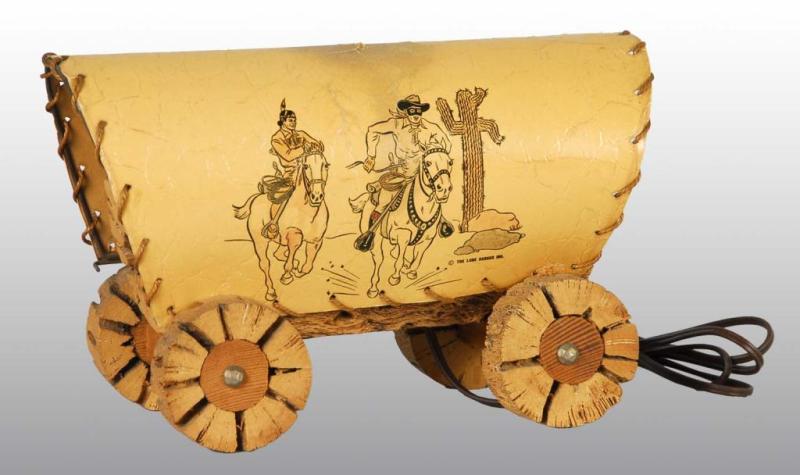 Appraisal: Lone Ranger Covered Wagon Lamp Description Pushed in area at