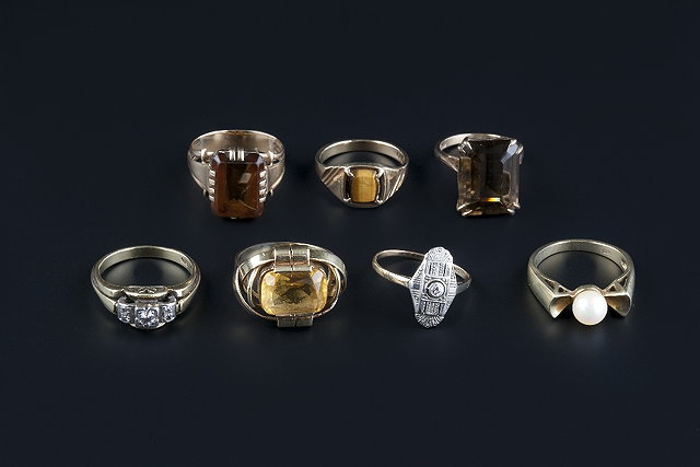 Appraisal: Seven gem set dress rings comprising a diamond set panel