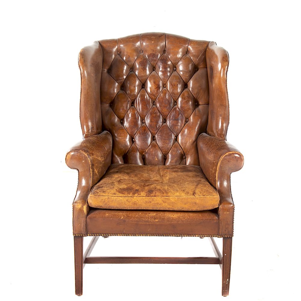 Appraisal: George III Style Leather Upholstered Wing Chair th century tuffted