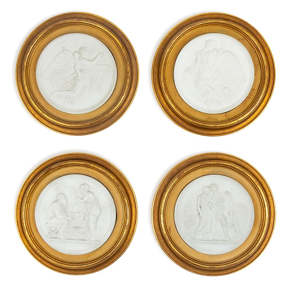 Appraisal: A Group of Four Bisque Plaques each set in a