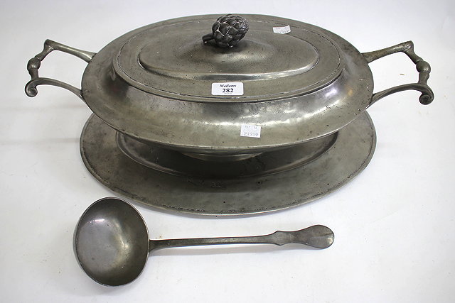 Appraisal: A PEWTER OVAL TUREEN COVER STAND AND A LADLE together