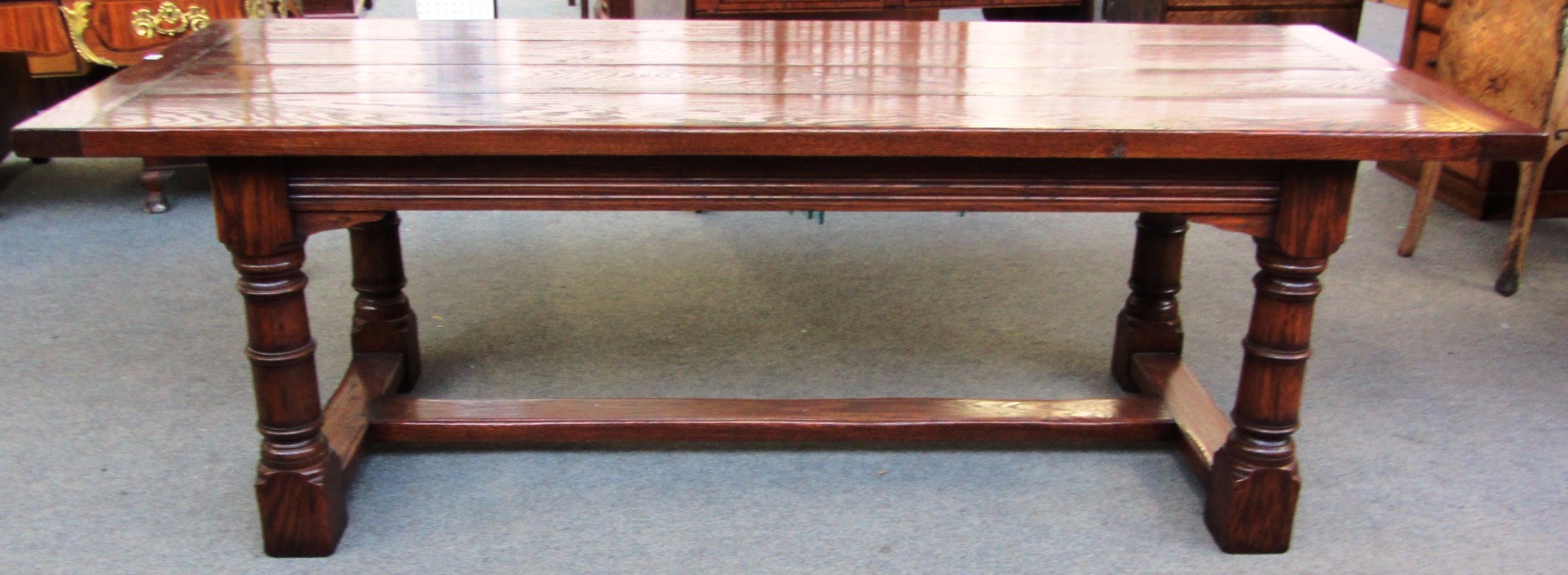 Appraisal: A th century style oak refectory table the cleated plank