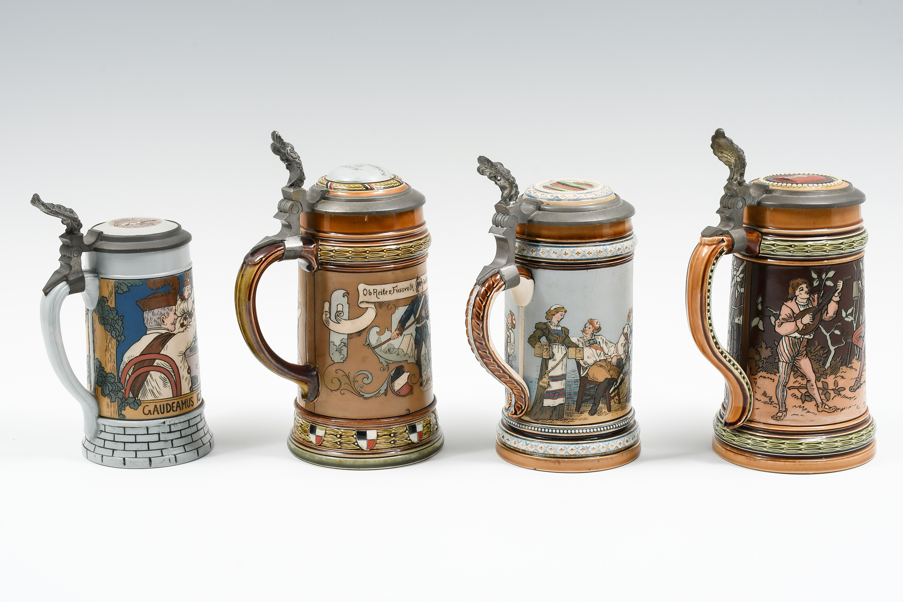 Appraisal: PC METTLACH FIGURAL TAVERN STEINS Comprising - With illegible impressed