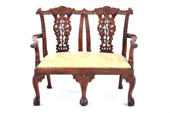 Appraisal: CHIPPENDALE STYLE MAHOGANY MINIATURE DOUBLE CHAIRBACK SETTEE th century Openwork