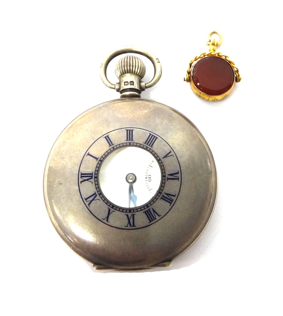 Appraisal: A gentleman's silver cased keyless wind half hunting cased pocket