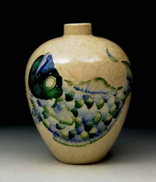 Appraisal: A MOORCROFT CREAM GROUND VASE of bulbous form with fish