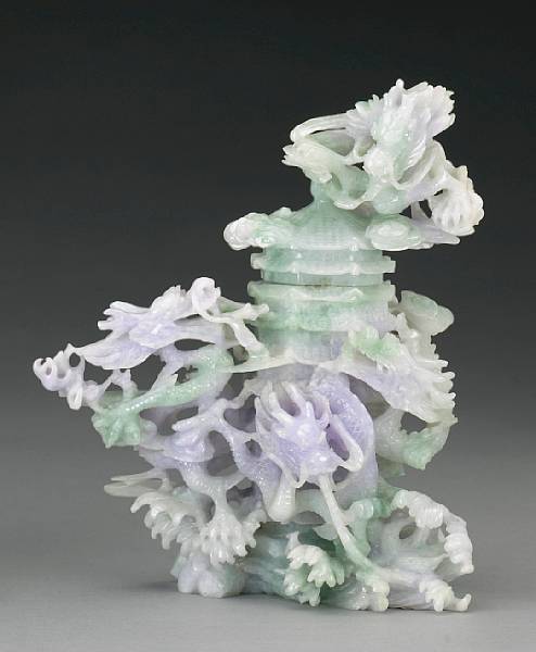 Appraisal: A pale green and lavender jadeite dragon and vase group