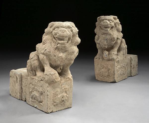 Appraisal: A pair of Chinese carved stone foo lions Each opposing