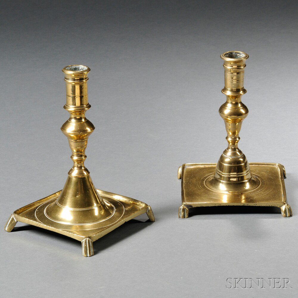 Appraisal: Two Similar Brass Square-base Footed Candlesticks Spain late th early