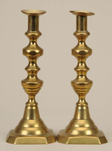 Appraisal: Lot of English Brass Candlesticks Description Circa Core-cast Significant bending