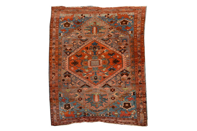 Appraisal: A PERSIAN HERIZ PASTEL GROUND RUG with a central hexagonal