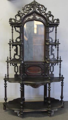 Appraisal: Victorian Walnut Etagere With fretwork carving and mirrored back From