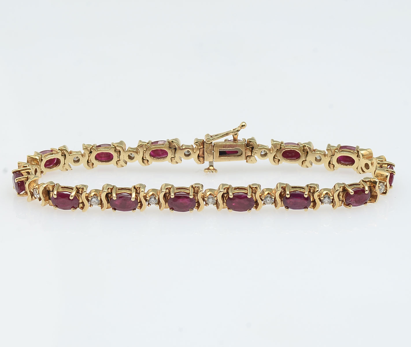 Appraisal: K RUBY DIAMOND BRACELET K yellow gold bracelet contains round