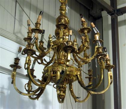 Appraisal: Louis XIII style sixteen light brass chandelier The baluster and