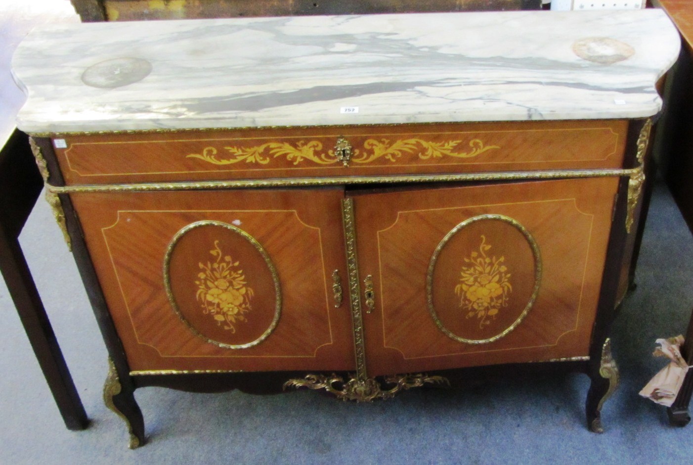 Appraisal: A Louis XVI style marquetry inlaid gilt metal mounted mahogany