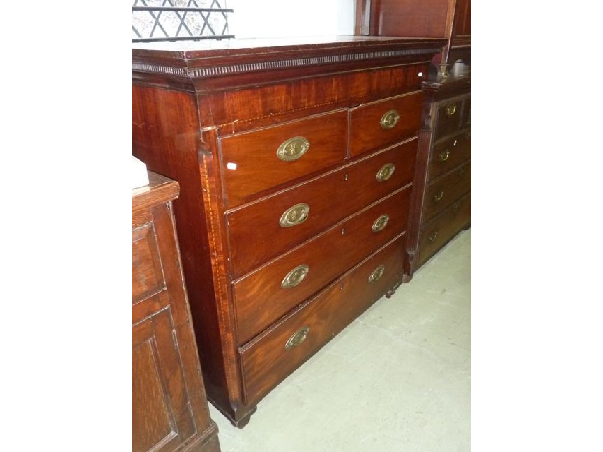 Appraisal: A Georgian mahogany chest of three long and two short